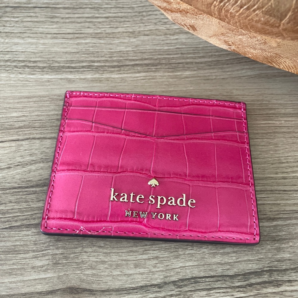 Beautiful brand new Kate Spade card holder with its tag.